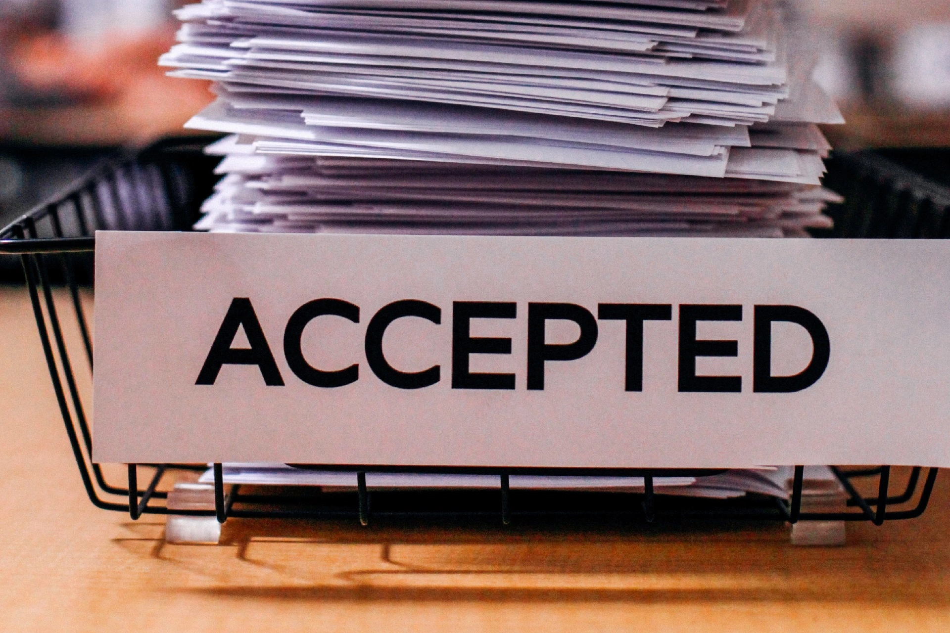 A pile of documents with a sign "ACCEPTED"